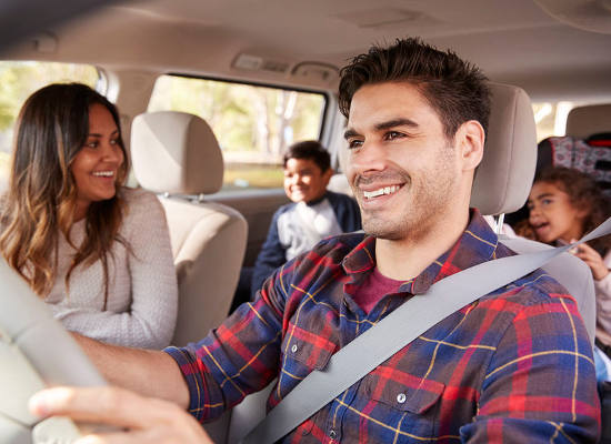 slide-108652876 happy family driving in car